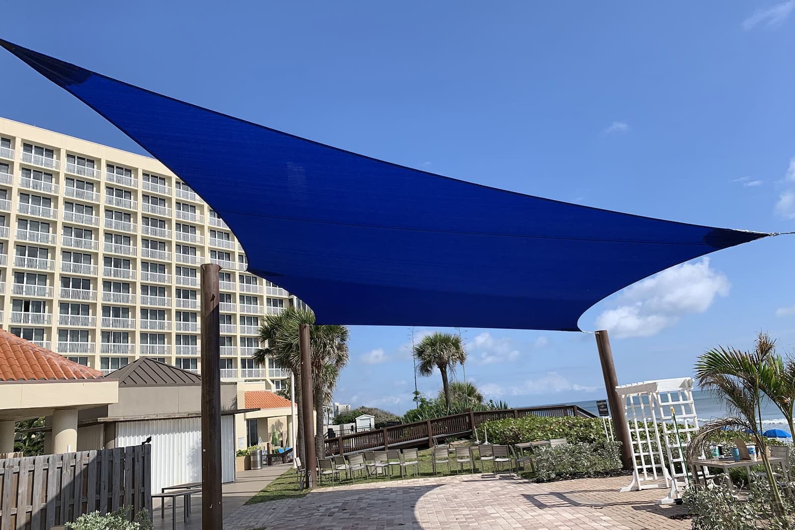 blue sail Discover the Elegance and Functionality of Shade Sails by ABC Awnings