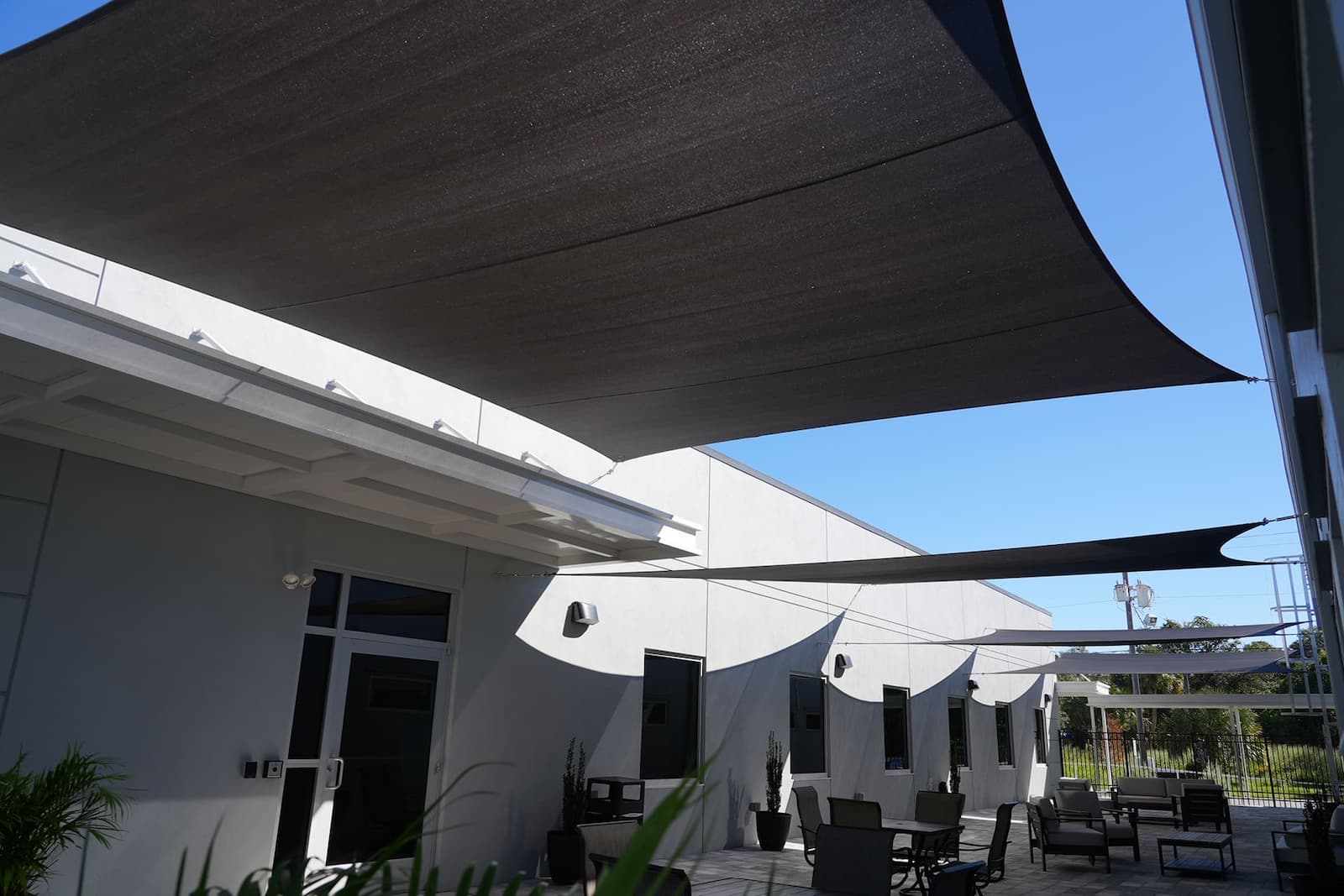 black sail Discover the Elegance and Functionality of Shade Sails by ABC Awnings